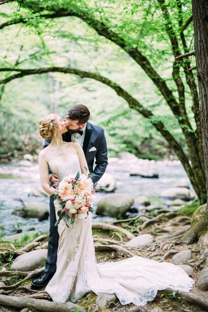 Gatlinburg TN Elopement - Bride and Groom kissing next to a beautiful mountain stream 