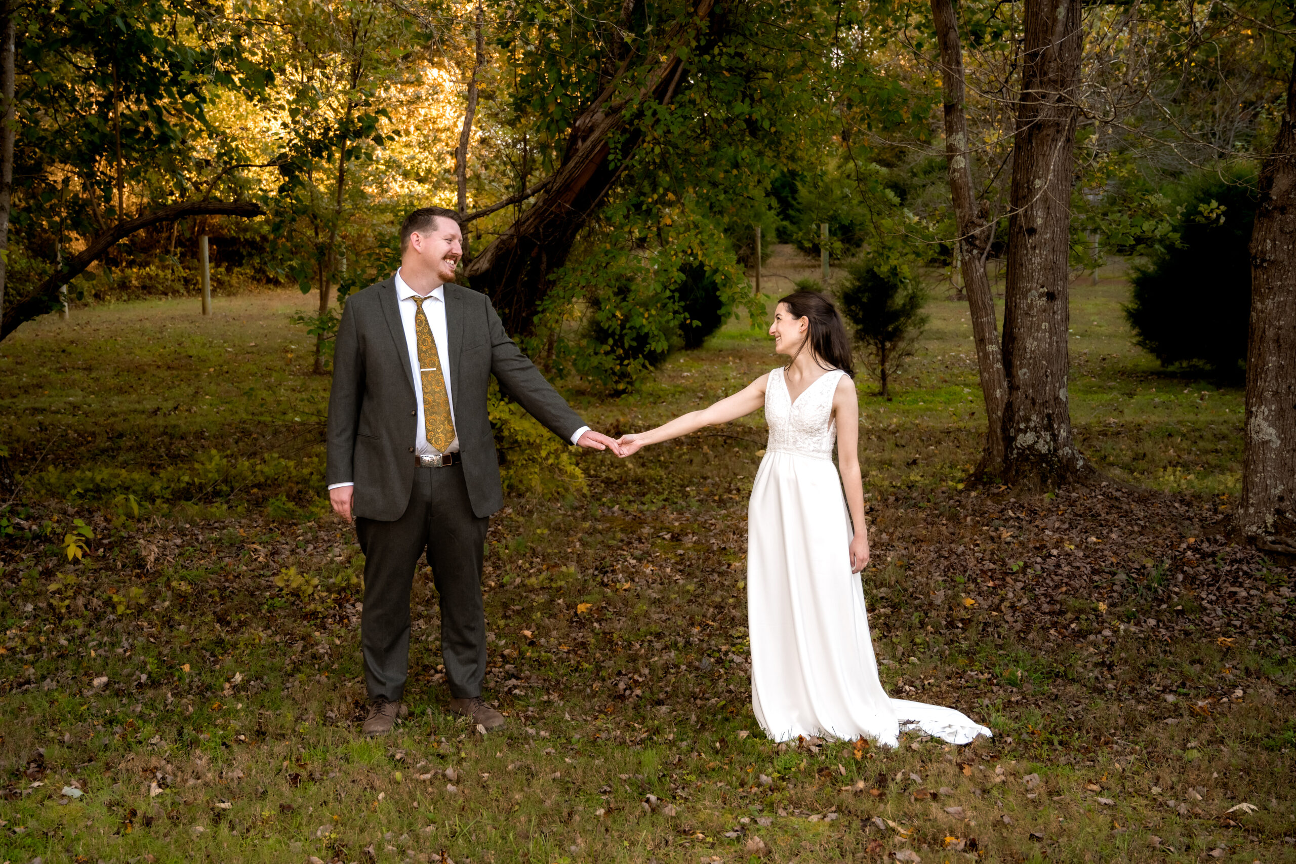 Bride & Groom Arms Extended Holding Hands - Wedding Timeline Blog Post